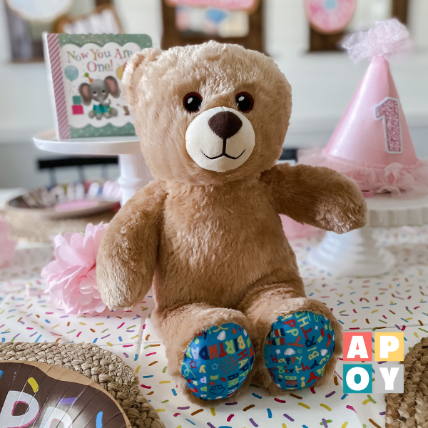 build a bear birthday bear sitting on decorated table