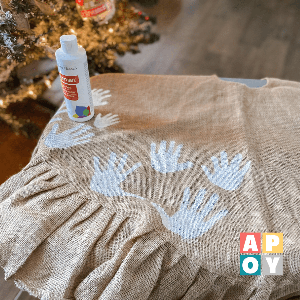 how to make a handprint christmas tree skirt,DIY handprint christmas tree skirt,family traditions,homemade holiday decorations,crafts with kids,winter break craft ideas,childhood keepsakes,creating memories during the holidays,easy traditions with kids