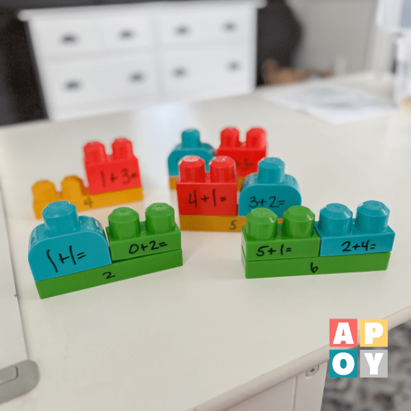 mega blocks with addition facts written in black marker on table