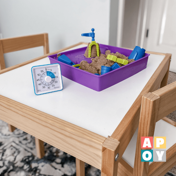 play sand and timer on child’s table