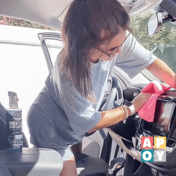 woman cleaning car